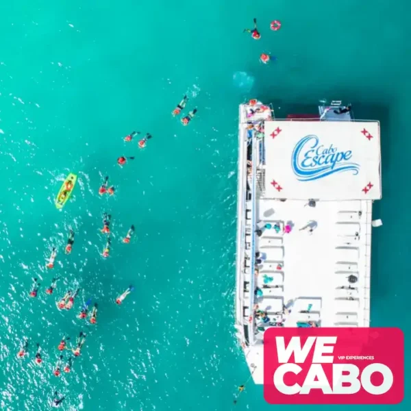 Image of a snorkeling cruise in Cabo San Lucas with views of the Arch and crystal-clear waters, courtesy of WECABO.