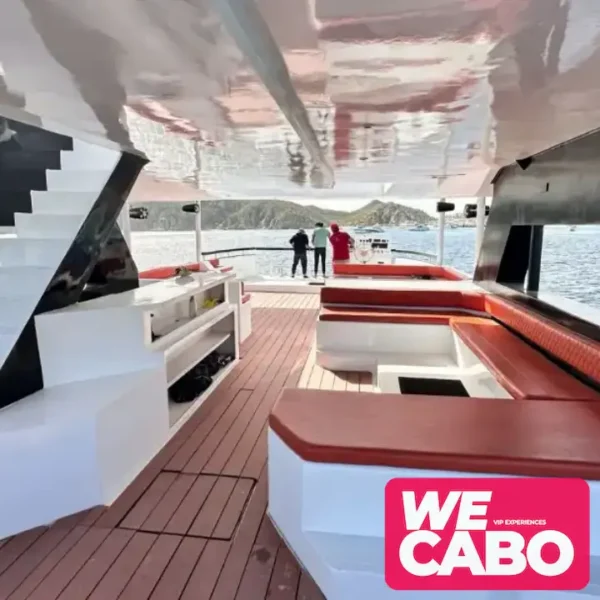 Image of a luxury catamaran sailing near the Arch of Cabo San Lucas, perfect for large groups, courtesy of WECABO.