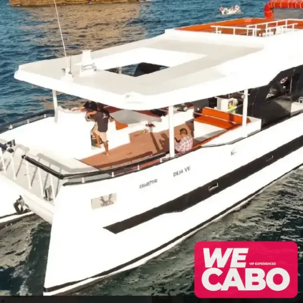 Image of a luxury catamaran sailing near the Arch of Cabo San Lucas, perfect for large groups, courtesy of WECABO.