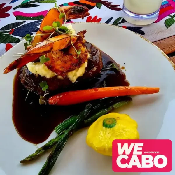 Image of a luxury yacht cruising at sunset in Cabo San Lucas, featuring a private chef dinner and premium bar, courtesy of WECABO.