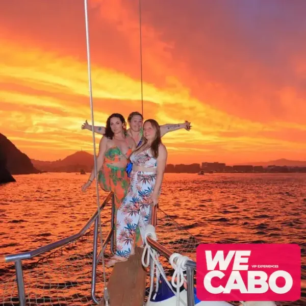 Image of a luxury yacht cruising at sunset in Cabo San Lucas, featuring a private chef dinner and premium bar, courtesy of WECABO.