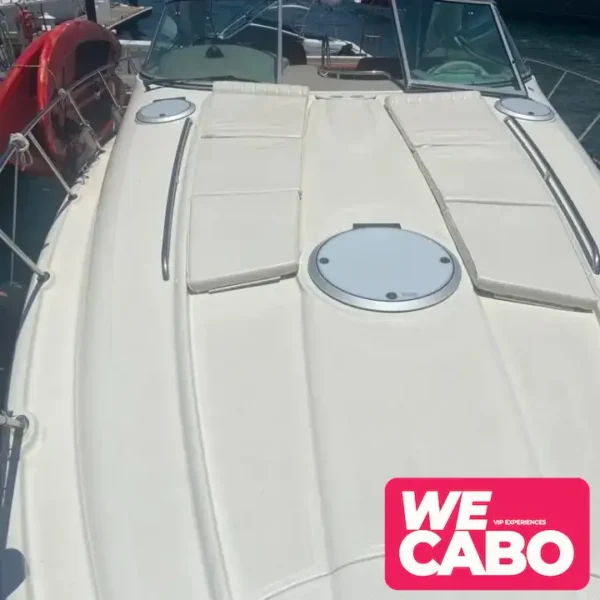 Image of a 38ft SCR Maxum yacht cruising through the waters of Cabo San Lucas, perfect for small groups, featuring an open bar, snorkeling gear, and a floating mat.