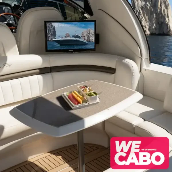 Image of a luxurious 45ft Sea Ray yacht cruising the crystal-clear waters of Cabo San Lucas, featuring spaces for relaxation, open bar, and gourmet menu.